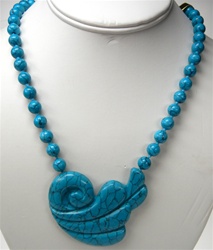 Beautiful Synthetic Turquoise Necklace. 8mm beads, knotted. Unique 60x55mm ornament. Necklace is 31 inches long