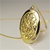 Wholesale Elegant Filigree Locket 25 x 18mm locket necklace with 14kt goldtone finished 24" chain. (1dozen minimum)