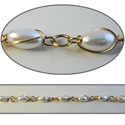 Wholesale Chanel Footage Wrapped Pearl Chain 10x6mm pearls wrapped in a gold plated setting, sold in 10 Feet minimum lengths.