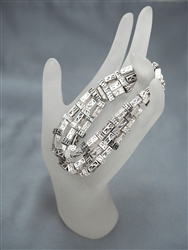 Trio of silver-tone stretch bracelets with cube beads to create a supremely luxe look.  One size fits most.