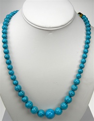 Beautiful Synthetic Turquoise Necklace. Graduated round beads are 6mm-16mm in size. Necklace is 24 inches long with silver plated clasp