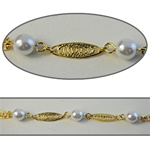 Wholesale Chanel Footage Alternating 6mm pearls with filigree ovals in gold plated setting, sold in 10 Feet minimum lengths.